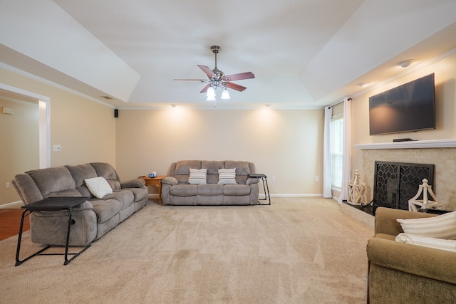 4600 Rustic Ridge Rd, Valdosta, GA 31602 - living area with a tray ceiling, ceiling fan, a fireplace, ornamental molding, and carpet