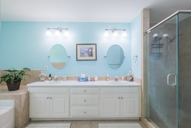 4600 Rustic Ridge Rd, Valdosta, GA 31602 - bathroom featuring a stall shower, double vanity, a garden tub, and tile patterned flooring