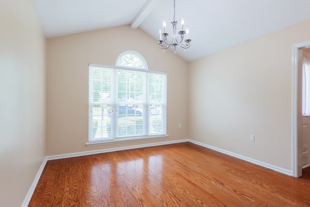 4600 Rustic Ridge Rd, Valdosta, GA 31602 - empty room featuring a chandelier, plenty of natural light, and wood finished floors