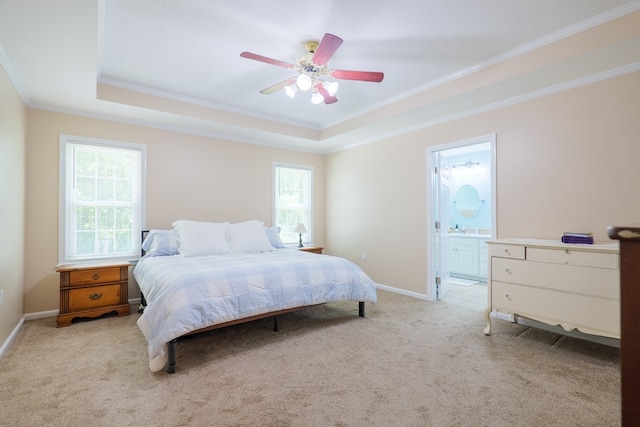 4600 Rustic Ridge Rd, Valdosta, GA 31602 - bedroom with a raised ceiling, ornamental molding, light carpet, ensuite bath, and a ceiling fan