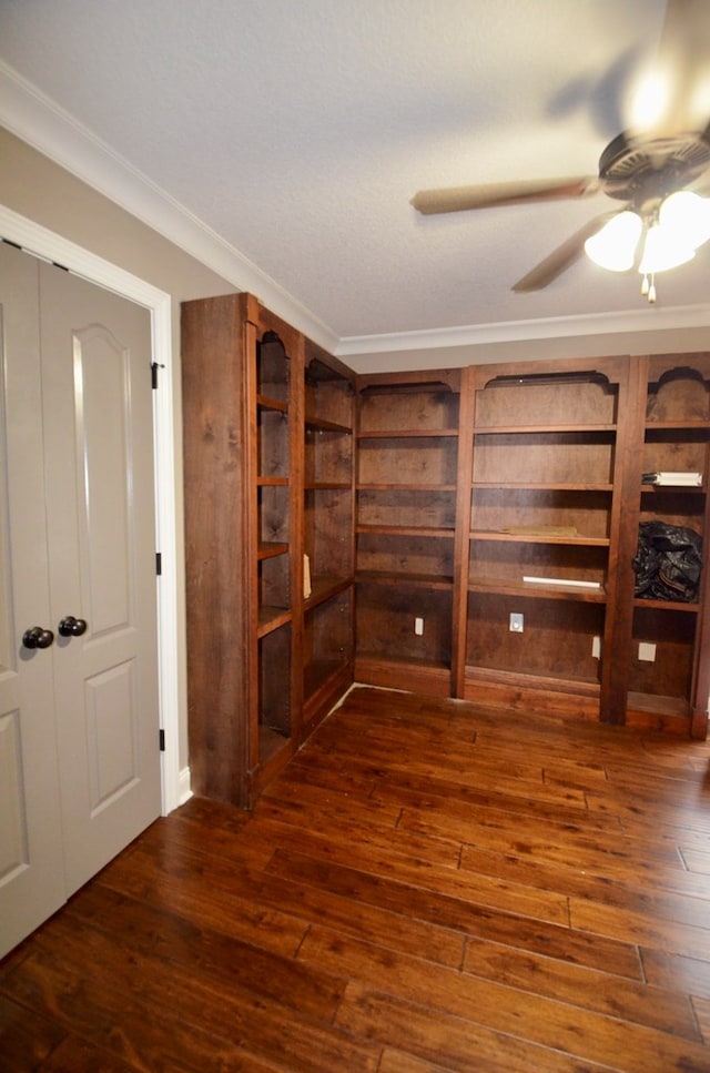 interior space featuring ceiling fan, crown molding, and dark hardwood / wood-style floors