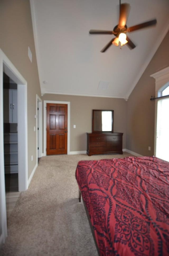 carpeted bedroom featuring ceiling fan and lofted ceiling