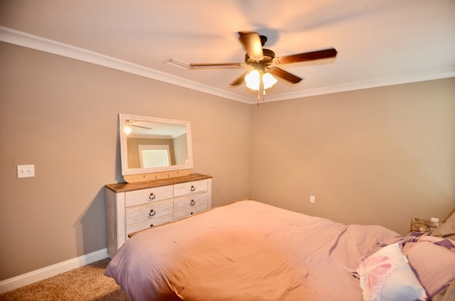 carpeted bedroom with ceiling fan and crown molding