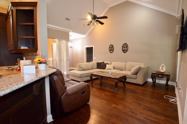 living room with decorative columns, ceiling fan, crown molding, dark hardwood / wood-style floors, and lofted ceiling