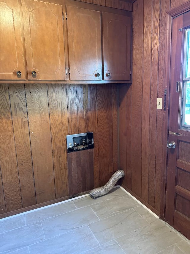 interior space featuring wood walls