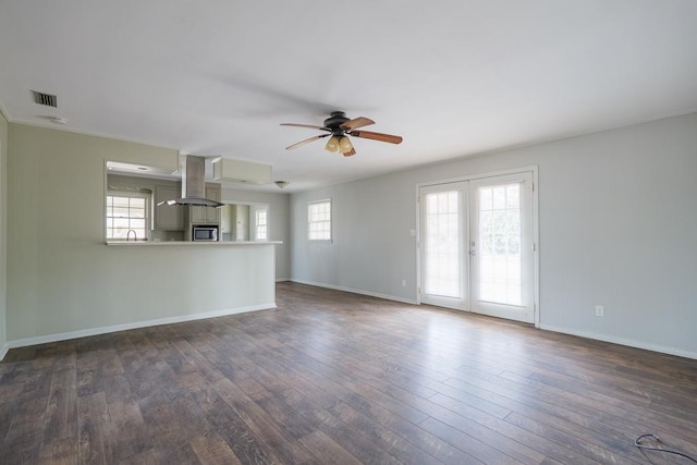 2205 Briarcliff Dr, Valdosta, GA 31602 - unfurnished living room featuring dark wood-style floors, french doors, baseboards, and ceiling fan