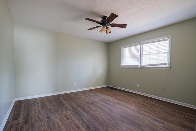 2205 Briarcliff Dr, Valdosta, GA 31602 - spare room with baseboards, a textured ceiling, dark wood-style floors, and a ceiling fan