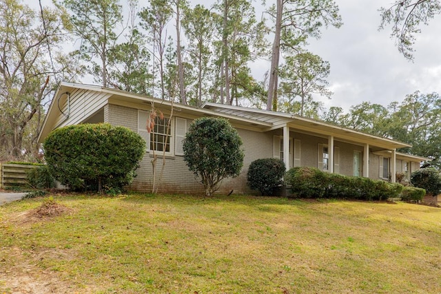 2205 Briarcliff Dr, Valdosta, GA 31602 - view of front of home with a front yard, fence, and brick siding