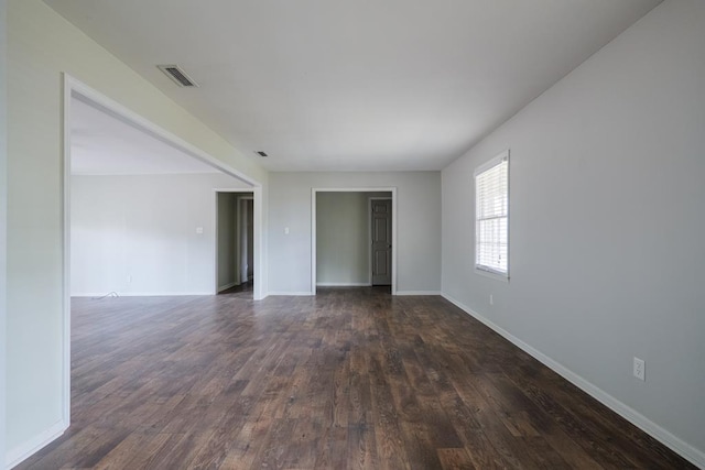 2205 Briarcliff Dr, Valdosta, GA 31602 - spare room featuring visible vents, dark wood-type flooring, and baseboards