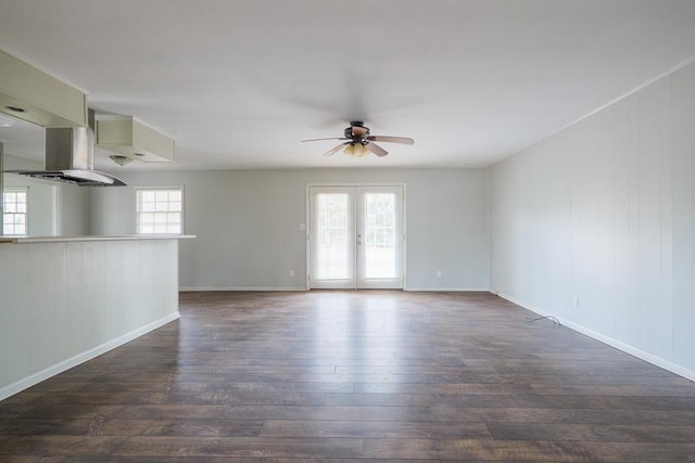 2205 Briarcliff Dr, Valdosta, GA 31602 - unfurnished living room featuring baseboards, a healthy amount of sunlight, dark wood finished floors, and a ceiling fan