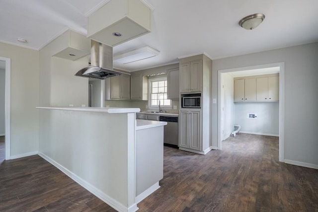 2205 Briarcliff Dr, Valdosta, GA 31602 - kitchen with dark wood-type flooring, built in microwave, dishwasher, light countertops, and island range hood
