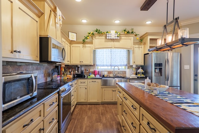 3908 Crusader Ct, Valdosta, GA 31605 - kitchen featuring wooden counters, wood finished floors, stainless steel appliances, a sink, and backsplash