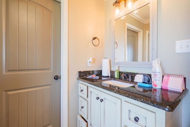 3908 Crusader Ct, Valdosta, GA 31605 - bathroom with crown molding and vanity