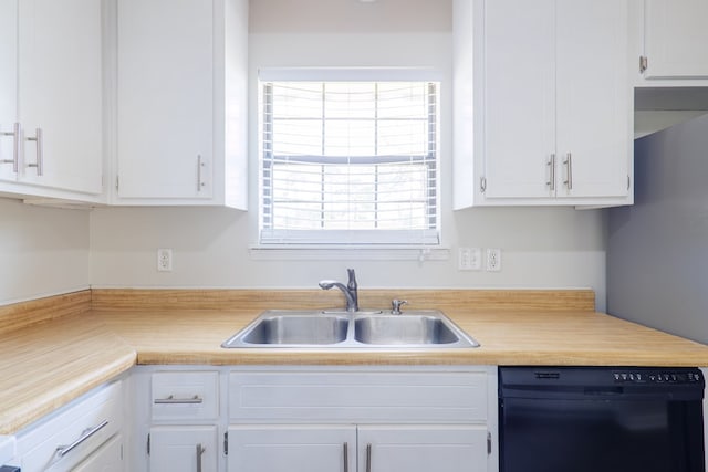 kitchen featuring white cabinetry, dishwasher, and sink