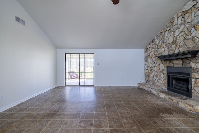 unfurnished living room with a fireplace, vaulted ceiling, and ceiling fan