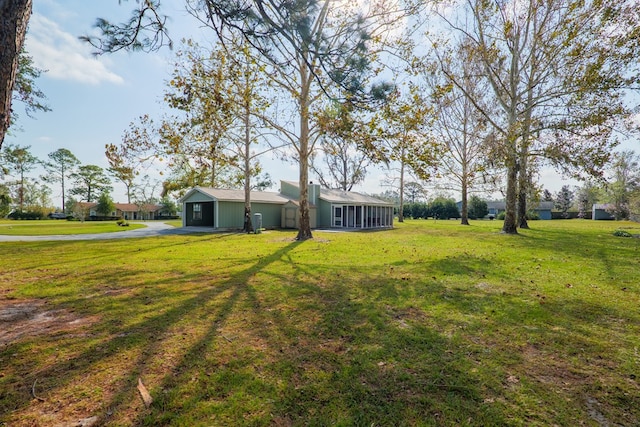 view of yard with a sunroom