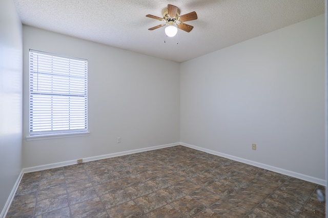 unfurnished room featuring a textured ceiling and ceiling fan