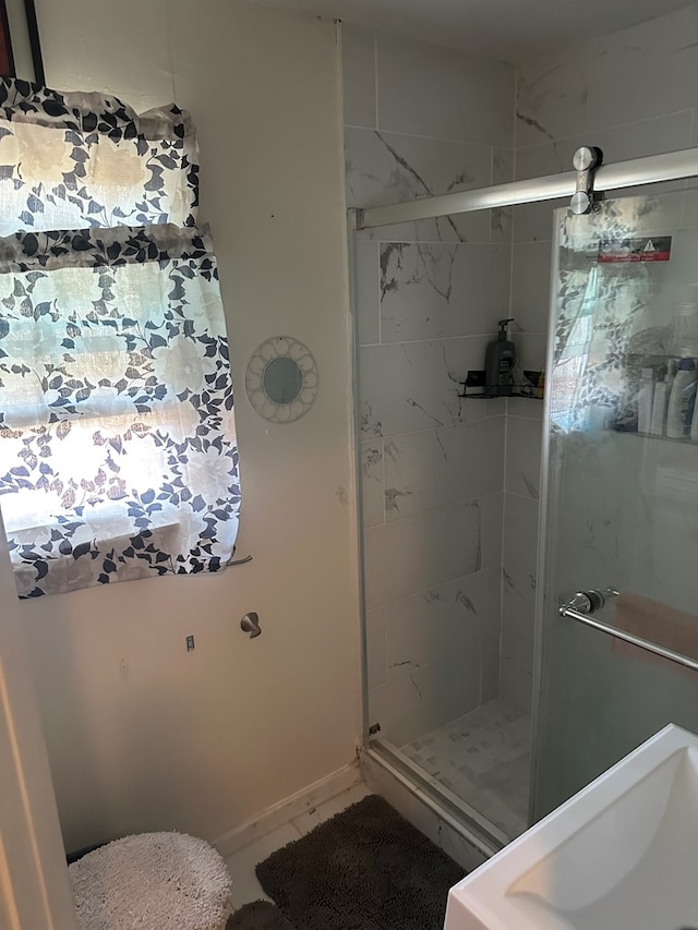 bathroom featuring a shower stall