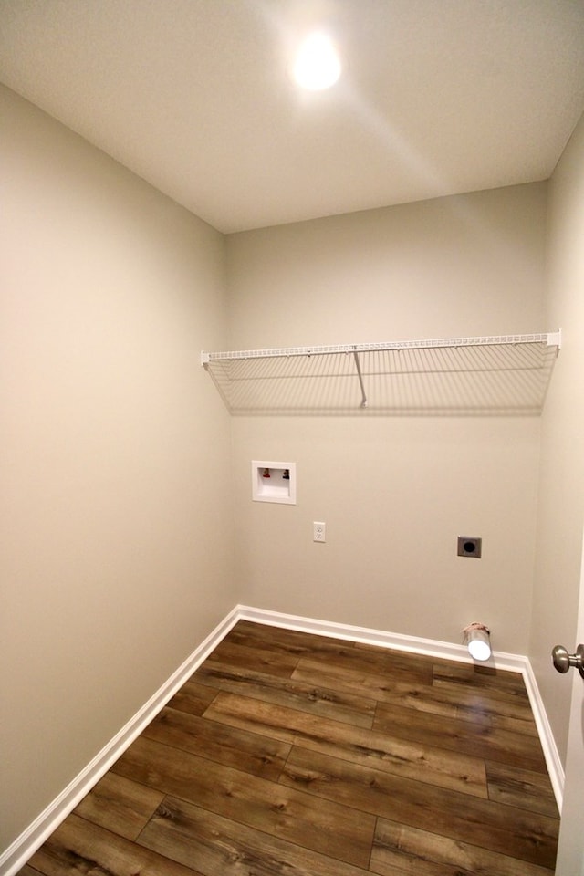 laundry area with baseboards, hookup for a washing machine, laundry area, and dark wood finished floors