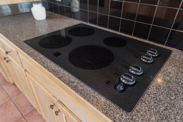 3532 Victoria Dr, Valdosta, GA 31602 - kitchen view of black electric stovetop and dark countertops