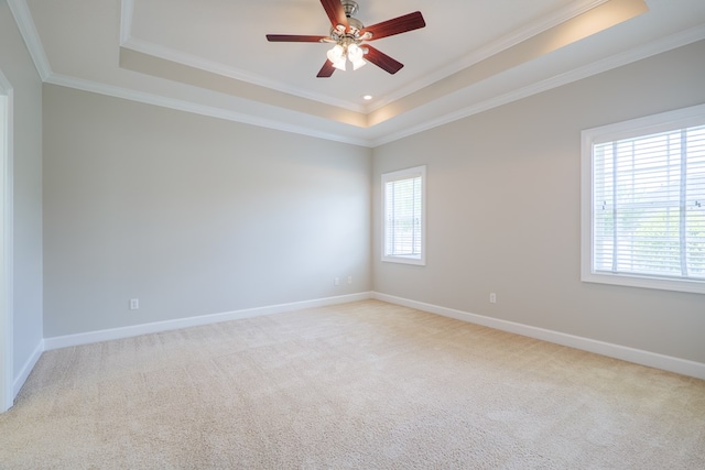 3532 Victoria Dr, Valdosta, GA 31602 - empty room with a tray ceiling, ornamental molding, light colored carpet, and ceiling fan