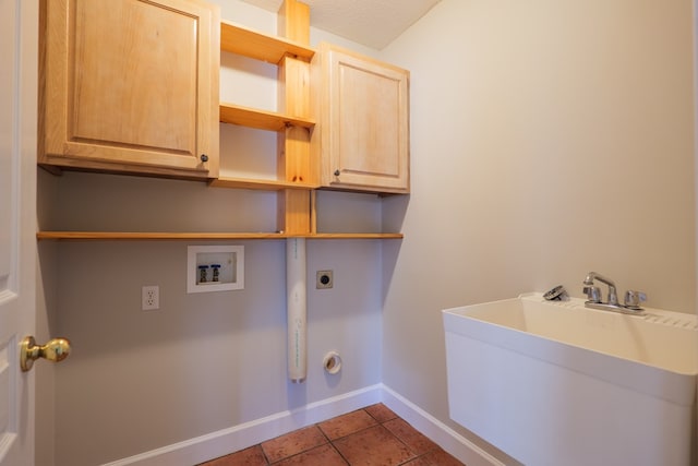 3532 Victoria Dr, Valdosta, GA 31602 - laundry area featuring washer hookup, electric dryer hookup, cabinet space, and tile patterned floors