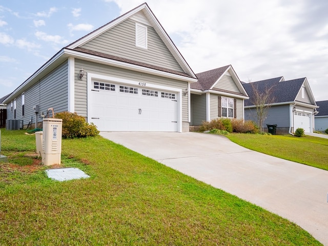 view of front facade with driveway, central air condition unit, a garage, and a front lawn