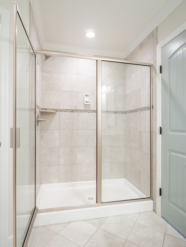 full bath featuring a shower stall and tile patterned floors