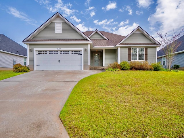 ranch-style house with a garage, concrete driveway, and a front lawn