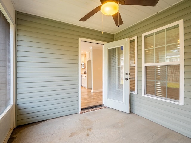 exterior space featuring ceiling fan