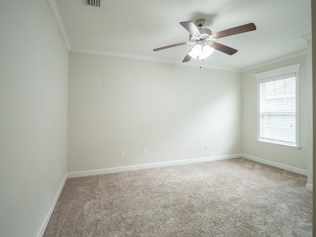 unfurnished room featuring carpet floors, baseboards, and ornamental molding