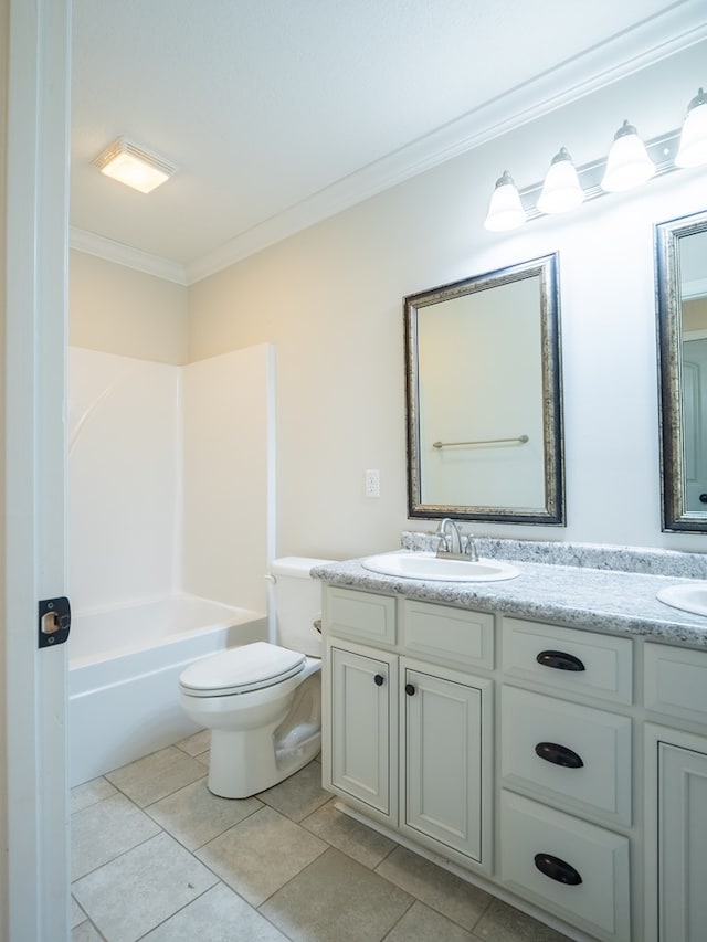 full bathroom with crown molding, a sink, toilet, and double vanity