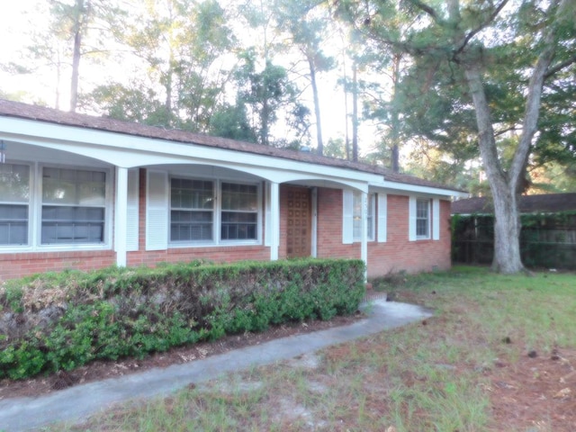 ranch-style house with brick siding