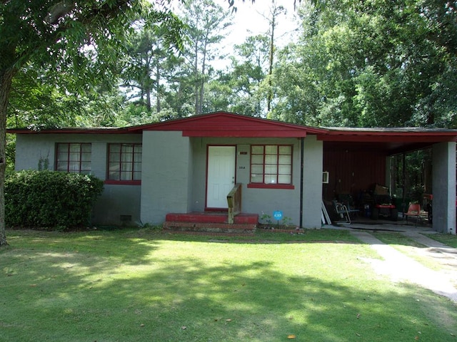 2314 Sterling Pl, Valdosta, GA 31602 - view of front facade featuring a front lawn, a carport, and stucco siding