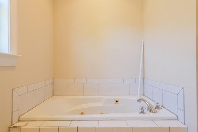 bathroom with tiled tub