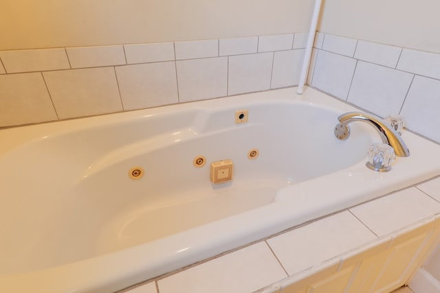 bathroom featuring a relaxing tiled tub