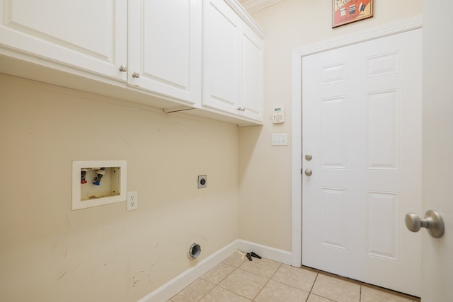 laundry area featuring cabinets, light tile patterned floors, hookup for a washing machine, and hookup for an electric dryer