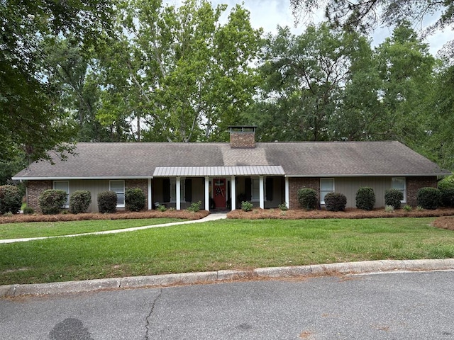 2406 Winding Way, Valdosta, GA 31602 - ranch-style home featuring a front lawn, a chimney, and a shingled roof