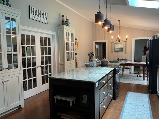 2406 Winding Way, Valdosta, GA 31602 - kitchen featuring black appliances, french doors, a kitchen island, light stone counters, and a chandelier