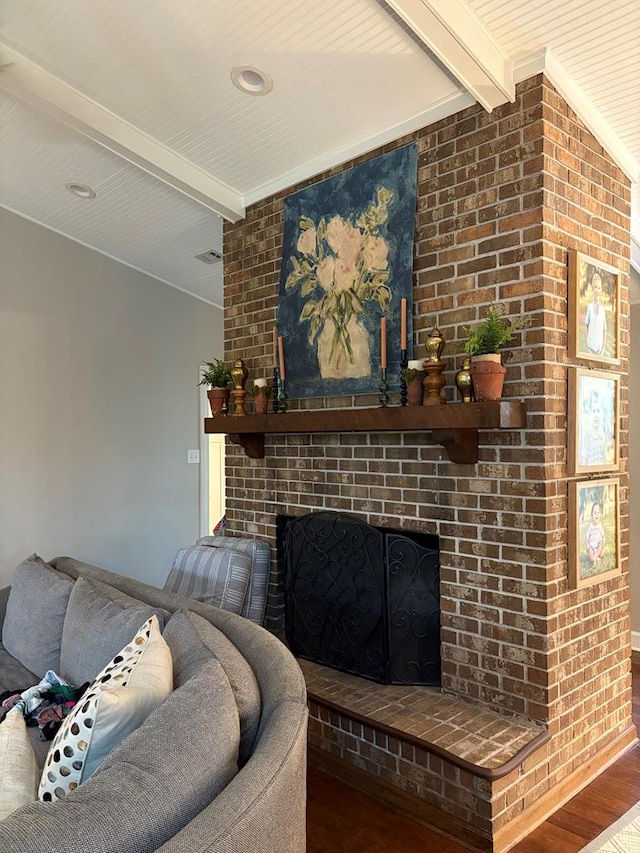 2406 Winding Way, Valdosta, GA 31602 - living area with beam ceiling, wood finished floors, and a fireplace