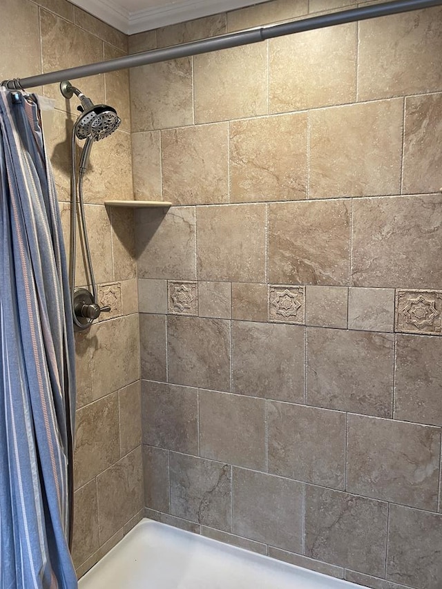 2406 Winding Way, Valdosta, GA 31602 - full bathroom featuring tiled shower and ornamental molding