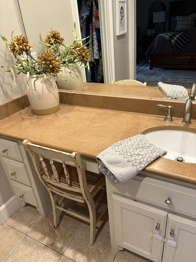 2406 Winding Way, Valdosta, GA 31602 - bathroom featuring vanity, tile patterned flooring, and a spacious closet