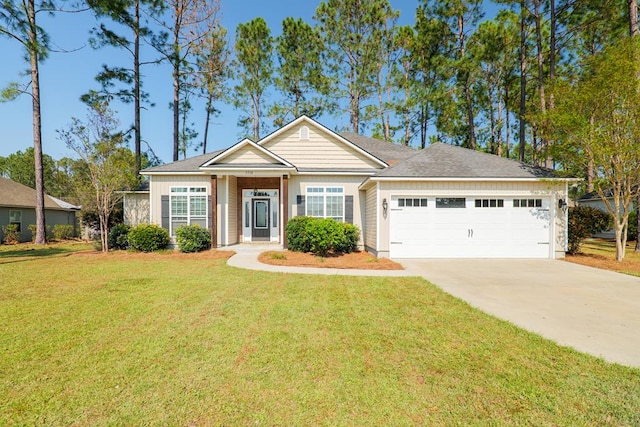 view of front of home featuring a garage and a front lawn