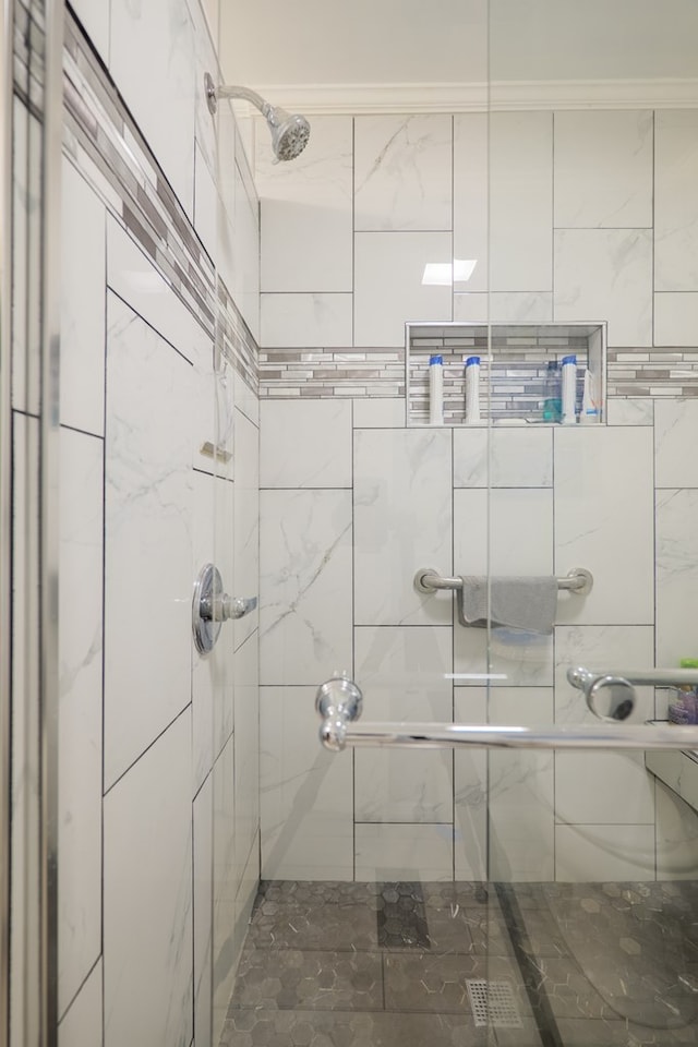 bathroom featuring a shower stall