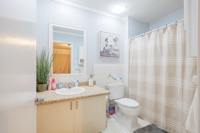 full bathroom with toilet, tile walls, tile patterned flooring, and vanity
