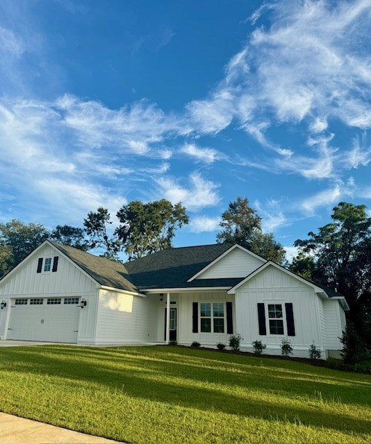 ranch-style house with board and batten siding and a front yard