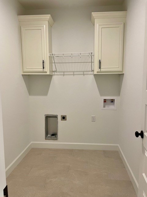 laundry area with washer hookup, cabinet space, baseboards, and electric dryer hookup