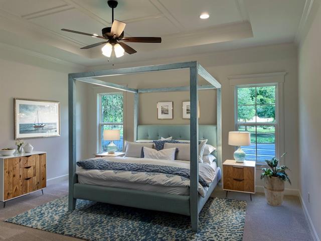 carpeted bedroom featuring crown molding, recessed lighting, a raised ceiling, a ceiling fan, and baseboards