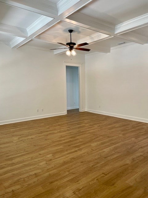 spare room with coffered ceiling, baseboards, and wood finished floors