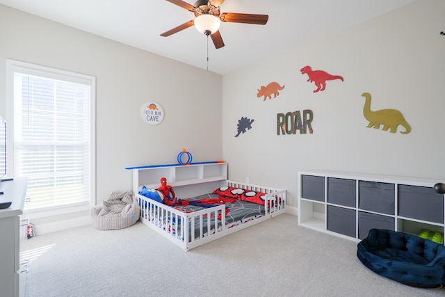 carpeted bedroom with baseboards and ceiling fan